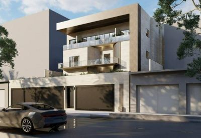 Side-angle view of the building facade featuring tiered balconies and large windows.