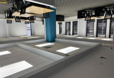 Collaborative workspace with unique ceiling-mounted desks and a central blue pillar.