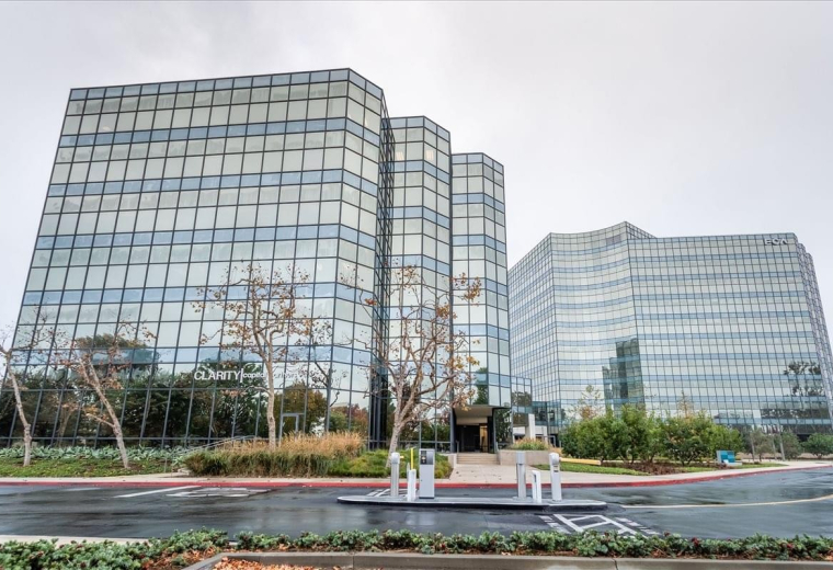 Exterior view of the glass-facade West Tower at Birch Street Center, 5000 Birch Street.