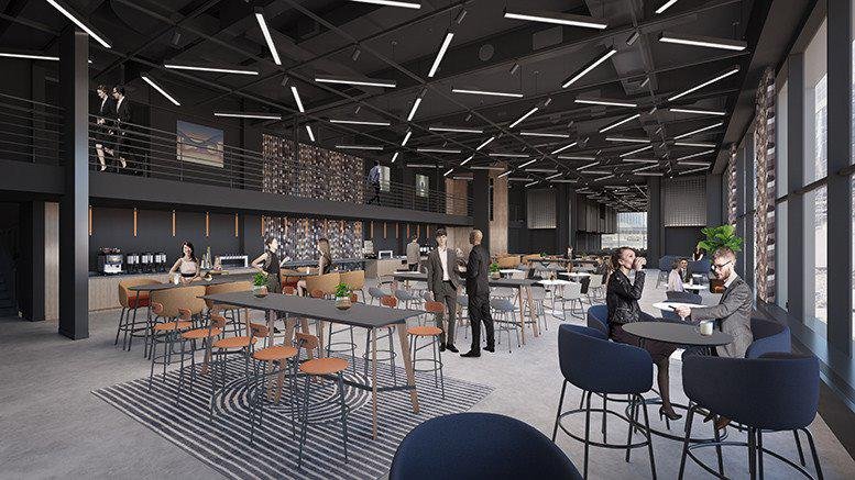 Modern communal cafe and lounge at 1 Liberty Street with dark industrial ceilings and tiered seating.