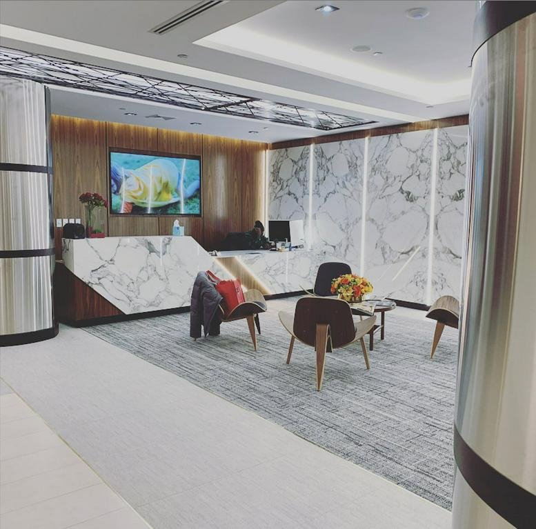 Modern marble reception desk and lounge area at 515 Madison Avenue, New York City.