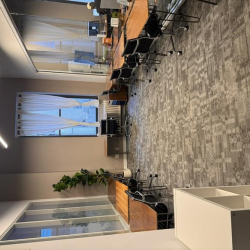 Contemporary office interior with a unique star-shaped overhead light fixture.