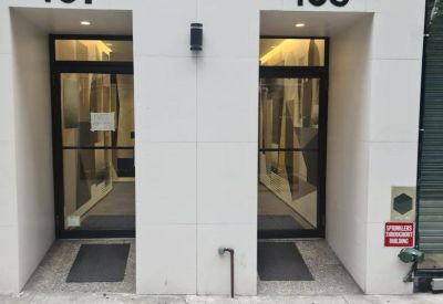 Close-up of the building entrances marked with numbers 165 and 167.