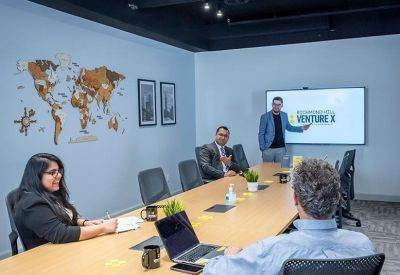 Conference room with a world map on the wall.