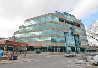 Exterior view of the tiered glass and concrete building at 2800 Skymark Avenue, Suite 200, Mississauga, Canada.