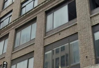 Exterior view of the stone facade at New York Business Center, 240 West 40th Street.