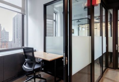 Private single-person workspace with a city view.