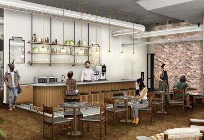 Modern on-site café with a wooden bar, pendant lighting, and casual seating areas.