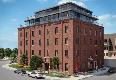 Exterior view of the historic brick and glass building at 30 Powerhouse Street, 1st & 2nd Floor.