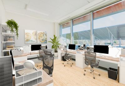 Bright private office suite with ergonomic chairs, light wood desks, and views of solar panels.