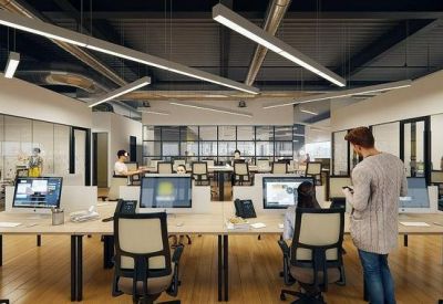Modern open-plan office with linear pendant lighting and glass-partitioned meeting rooms.
