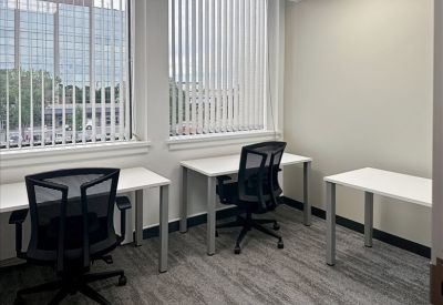 Small office room with two desks and mesh office chairs