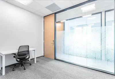 Private work booths with cushioned seating and individual task lighting.