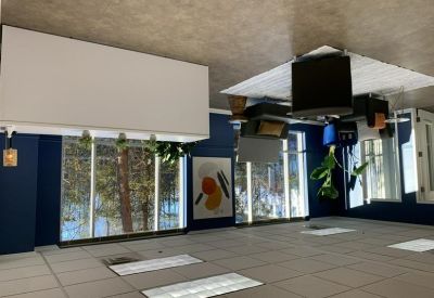 Lobby area featuring blue accent walls and a view down a bright hallway.