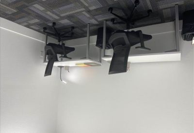 Private office suite with two white desks and ergonomic black chairs.