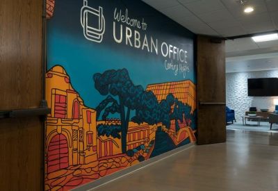 Hallway featuring a large colorful wall mural and entrance to the lounge area.