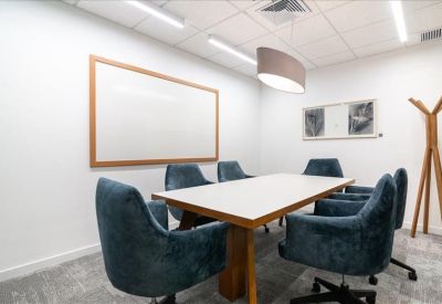Conference room with modern chairs and a whiteboard at Avenida Carrera 86, Suite 55A-75, Bogota