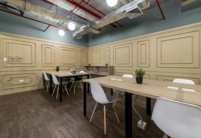 Collaborative workspace with wood paneling and white chairs, Avenida Manuel Olguín 327, Lima, Peru.