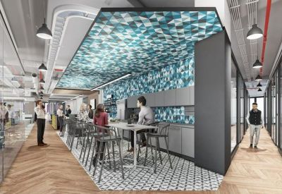 Vibrant coworking cafe space featuring a blue geometric feature ceiling and high-top seating.