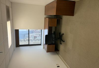 Private office suite at 121 South Broad Street with a desk and large window overlooking the city.