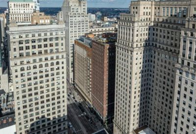 Elevated view of the surrounding urban skyline and architectural landmarks from a high floor.