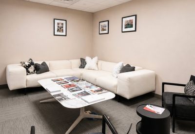Comfortable lounge area with couches and magazines.