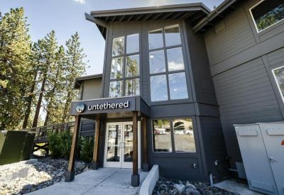 Exterior entrance of the modern two-story building at 195, U. S. 50 with Untethered signage.