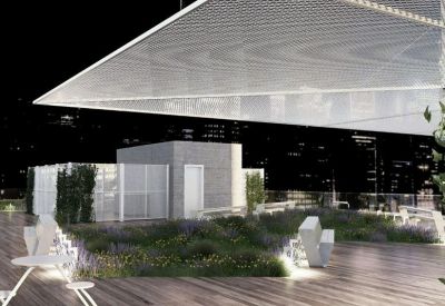 Night view of a rooftop garden terrace with city lights in the background.