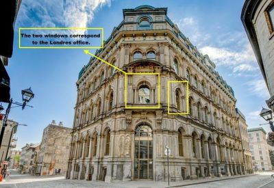 Close-up of exterior building windows highlighted with yellow annotations.