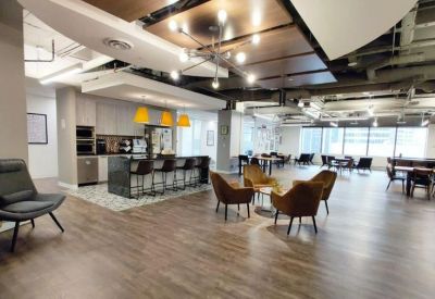 Spacious lounge and breakout area at 324, 8 Avenue Southwest, 12th Floor featuring warm lighting and modern seating.