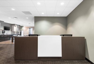 Professional reception area with a minimalist front desk.