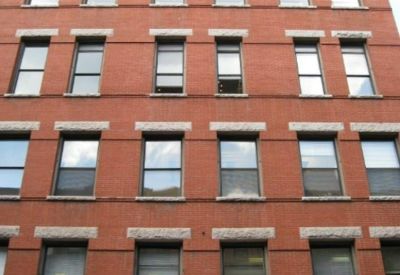 Exterior view of the red brick building at 353 West 48th Street, Floor 4, New York.