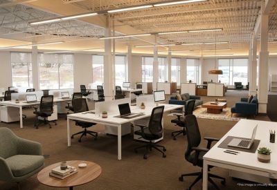 Spacious open-plan workspace with modern white desks and ergonomic chairs.