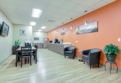 Communal room with kitchenette and seating area.