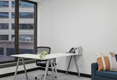 Private office suite at 501, Union Street, Suite 400 with an L-shaped desk and city views.