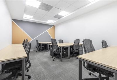 Internal office suite with desks and a geometric feature wall.