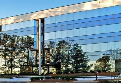 Modern glass-facade exterior of 5540 Centerview Drive, Suite 200, Raleigh, North Carolina.