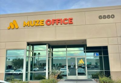 Exterior entrance and signage for Muze Office at 6860 Bermuda Rd, Suite 200.