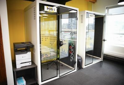 A pair of soundproof privacy pods for focused work or phone calls.