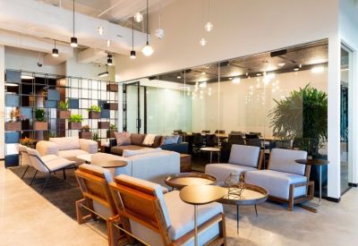 Stylish reception lobby with contemporary lounge furniture and decorative shelving.