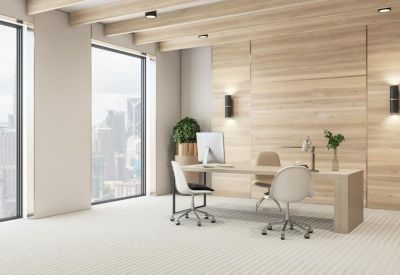 Bright modern office with light wood walls and large windows overlooking the city.
