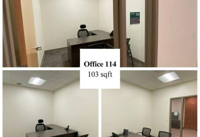 Small office space with desk and two chairs.