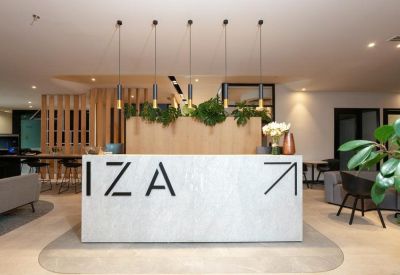 Reception area with modern decor and plants.