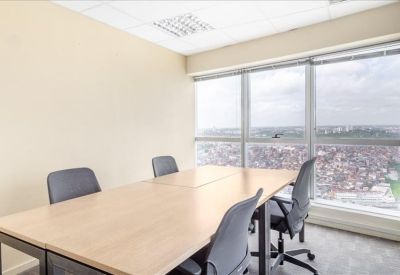 Private office suite with a simple wooden desk and a window overlooking the city landscape.