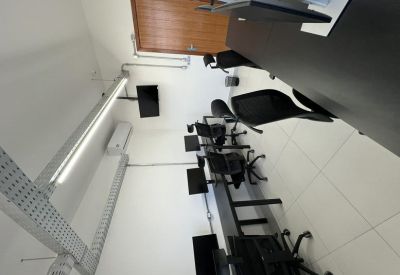 Overhead view of an office with multiple computers and a wooden door.