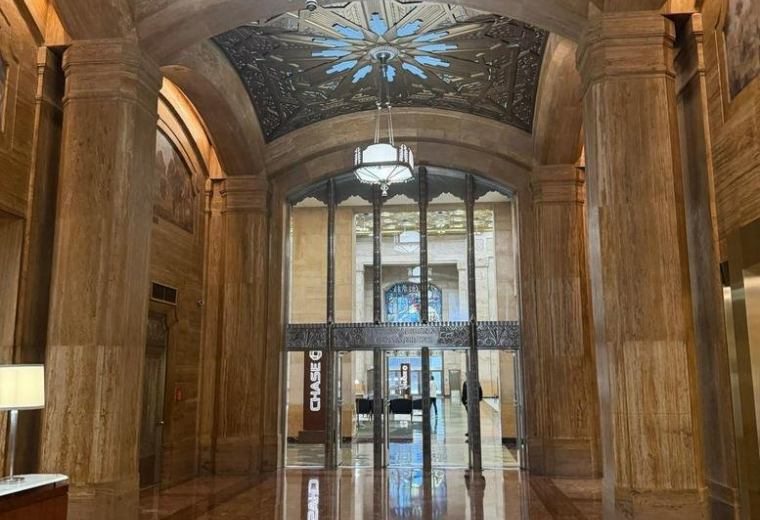 Grand lobby entrance with ornate gilded ceilings and polished stone floors.