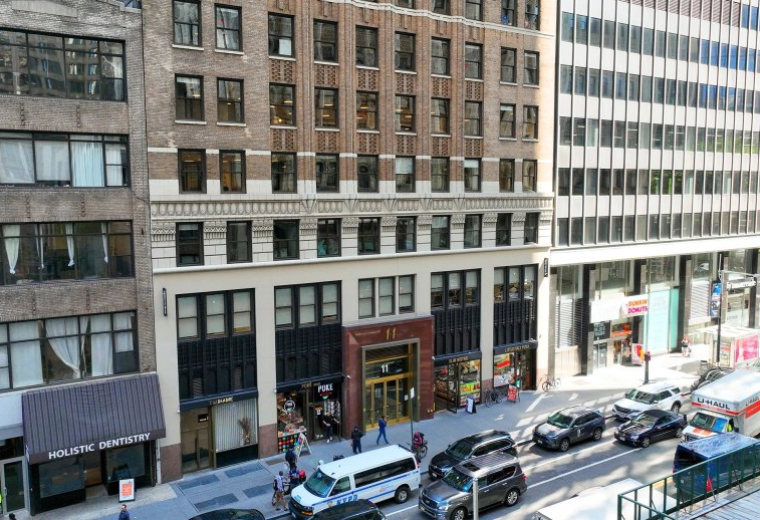 Exterior view of the classic stone and brick facade of 11 Park Place in New York City.