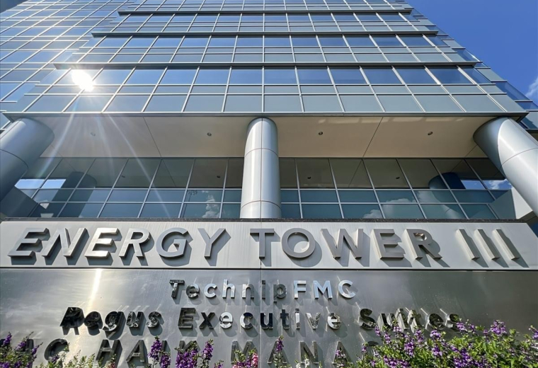 Ground level exterior view of the glass facade at Energy Tower III.
