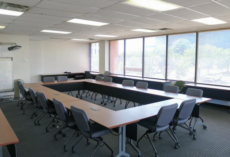 Exterior view of the brick office building facade at 1903 Central Drive, Bedford, Texas.