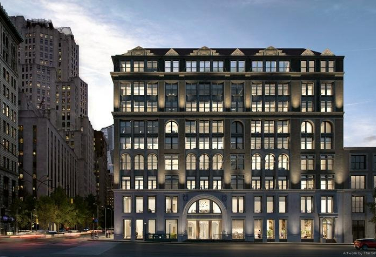 Evening view of the historic illuminated facade of the 287 Park Avenue South, United Charities Building Complex.